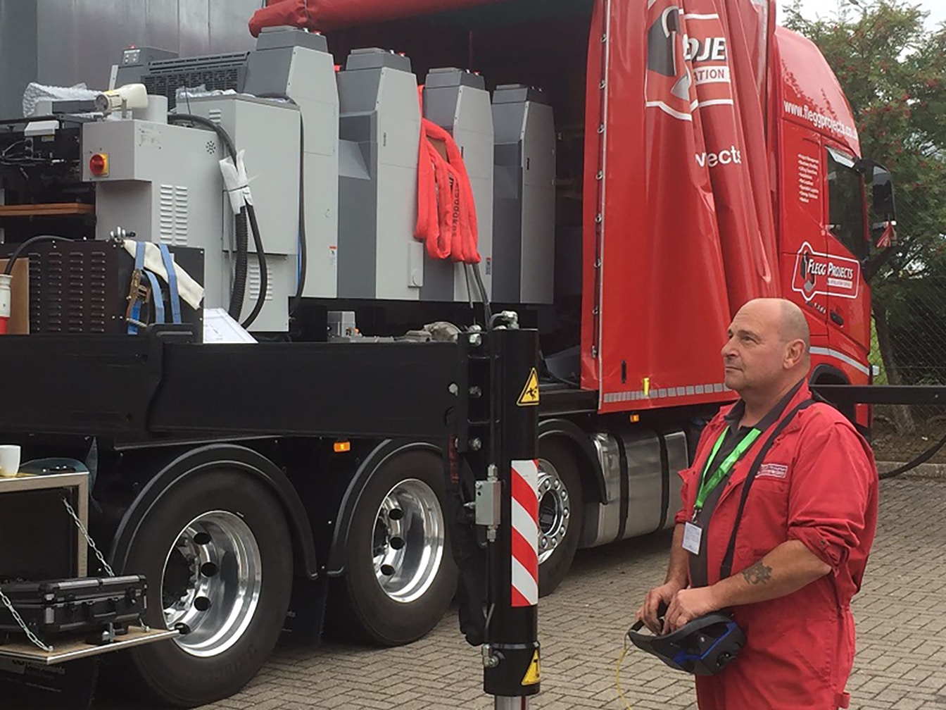 Operator moving equipment from lorry