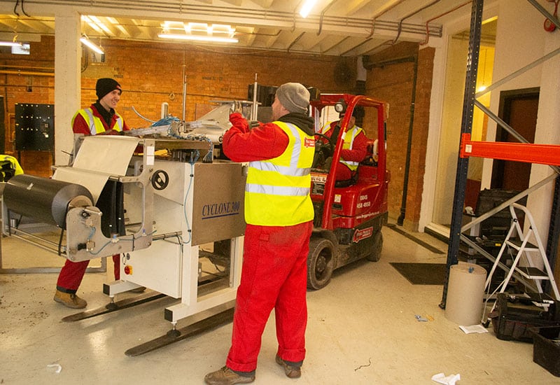 forklift moving printing machine