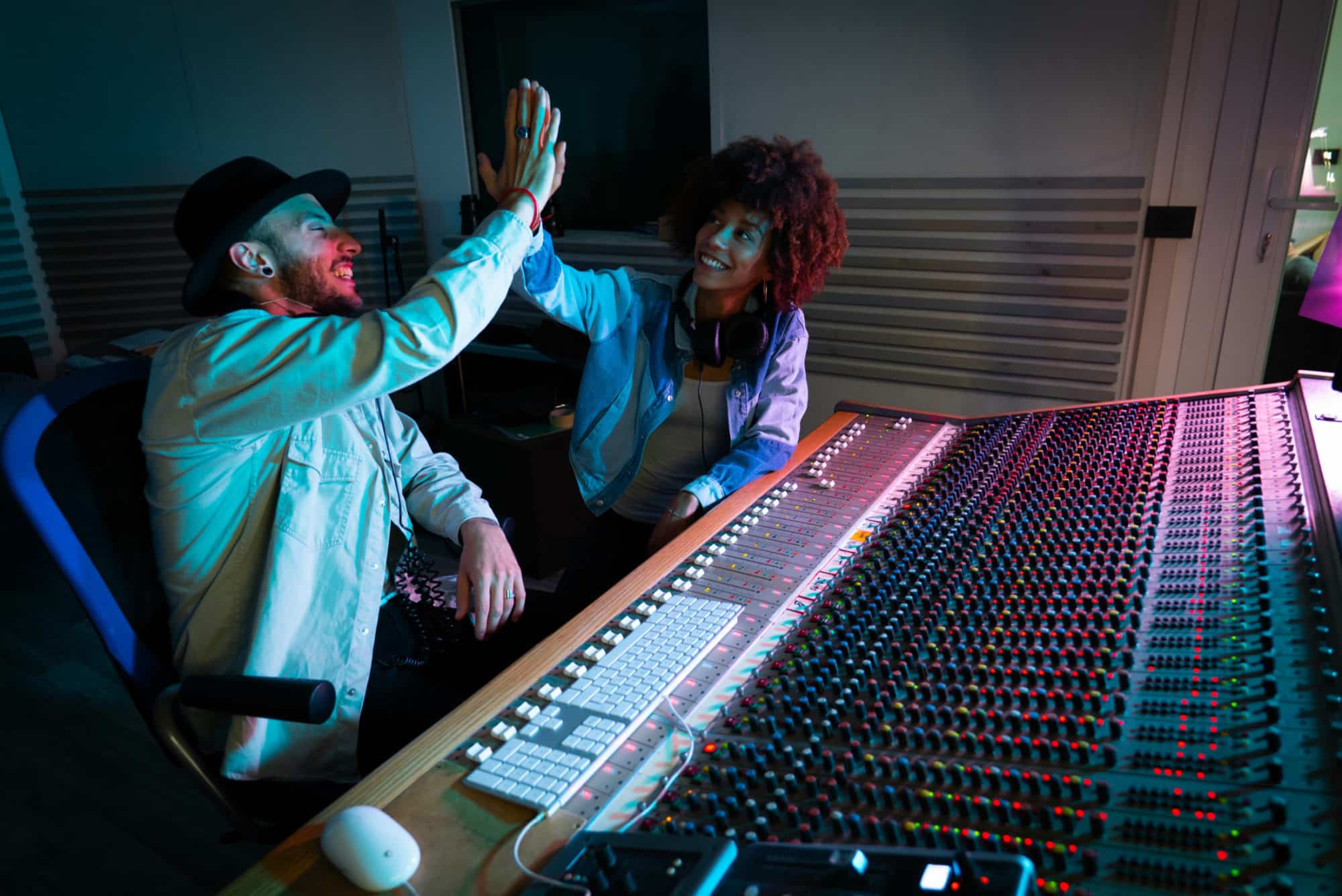Artists at a mixing desk