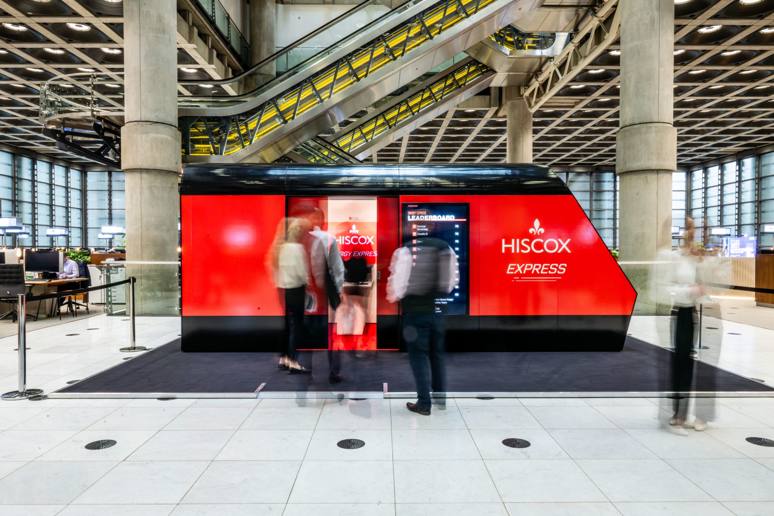 red train carriage with people entering