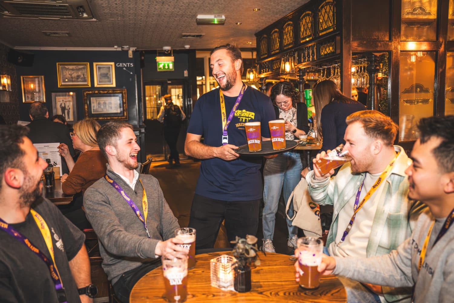 group of men laughing in a pub